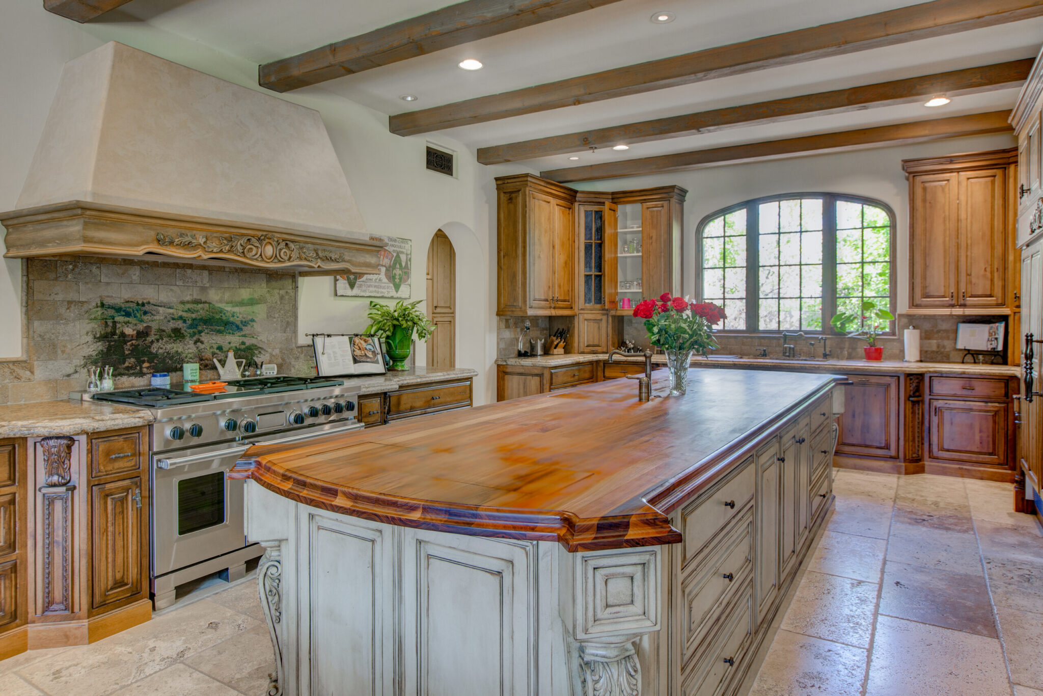 Interior traditional wood and stone kitchen photo for real estate listing.