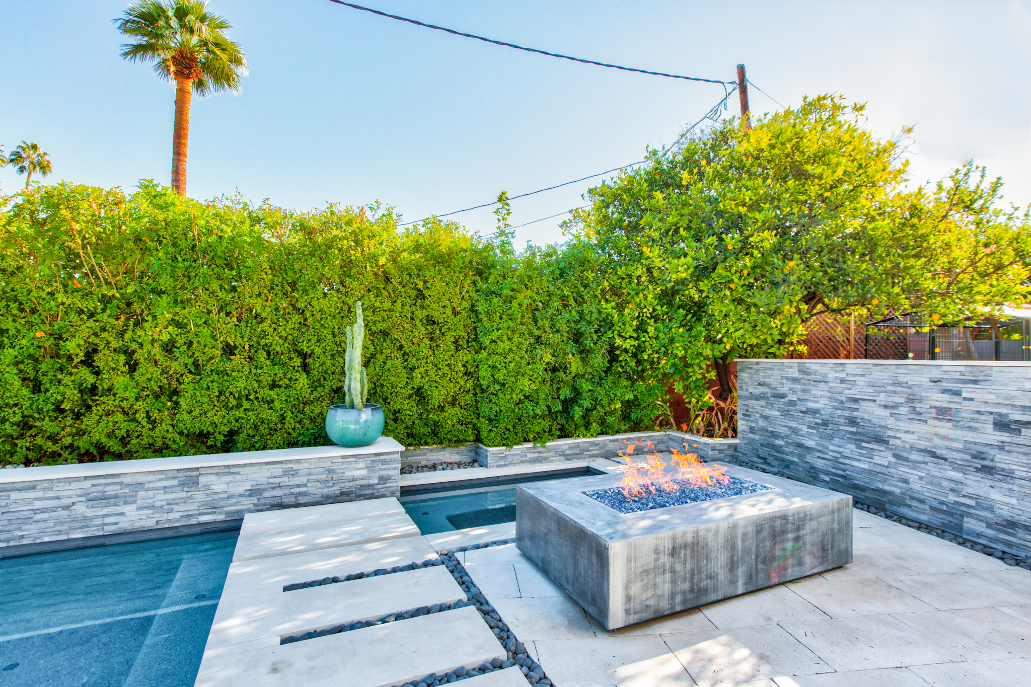 Outdoor hot tub and fire pit photo for real estate listing by Remethod.