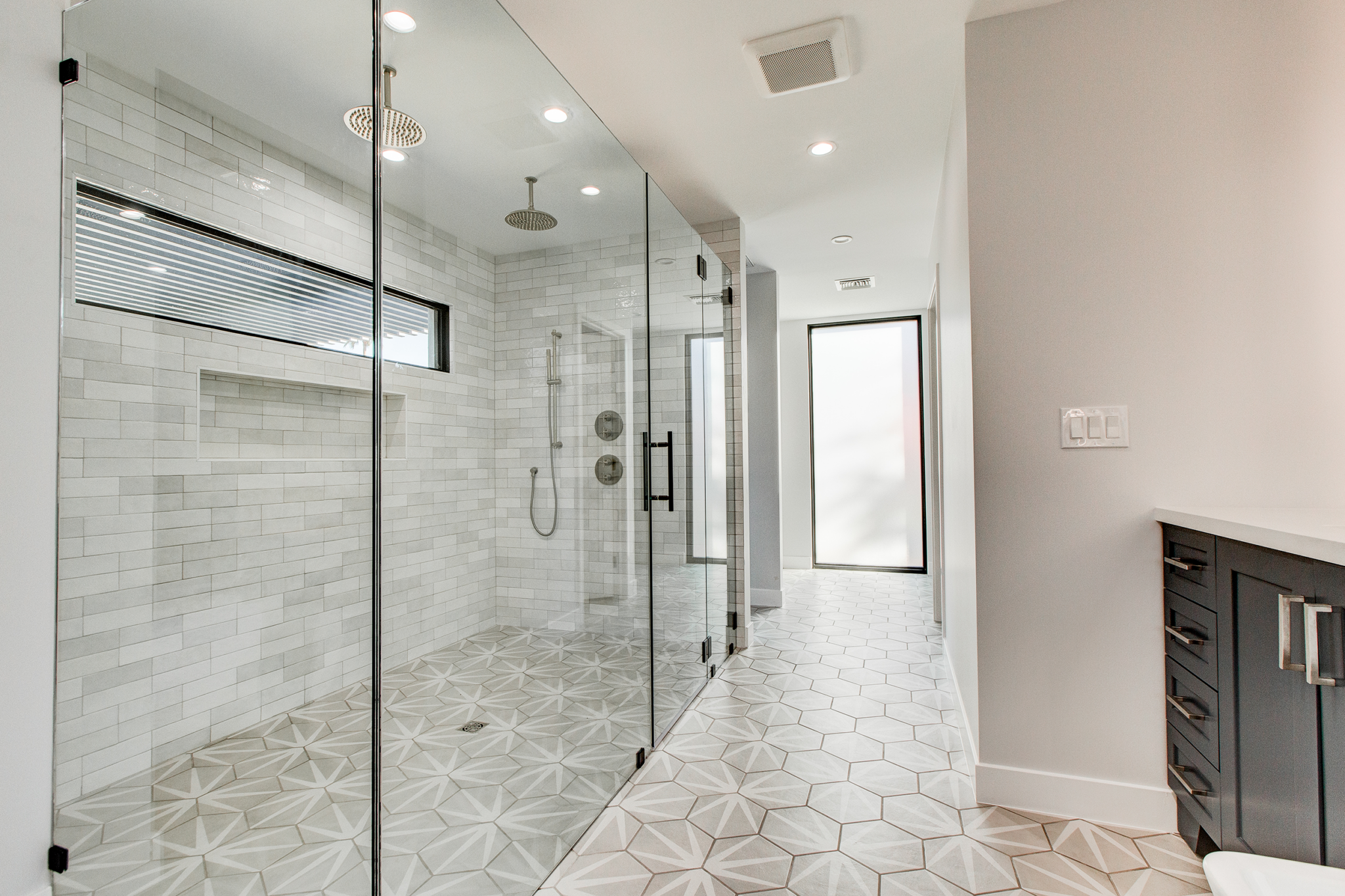 Professional photo of master bathroom for property listing.